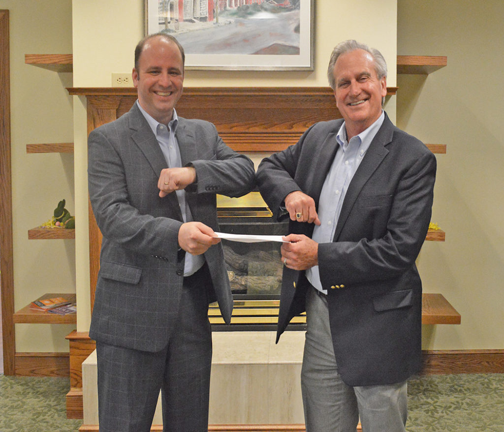 Moravian Ministries Foundation in America president and CEO Chris Spaugh receives funding from Salemtowne president and CEO Mark Steele